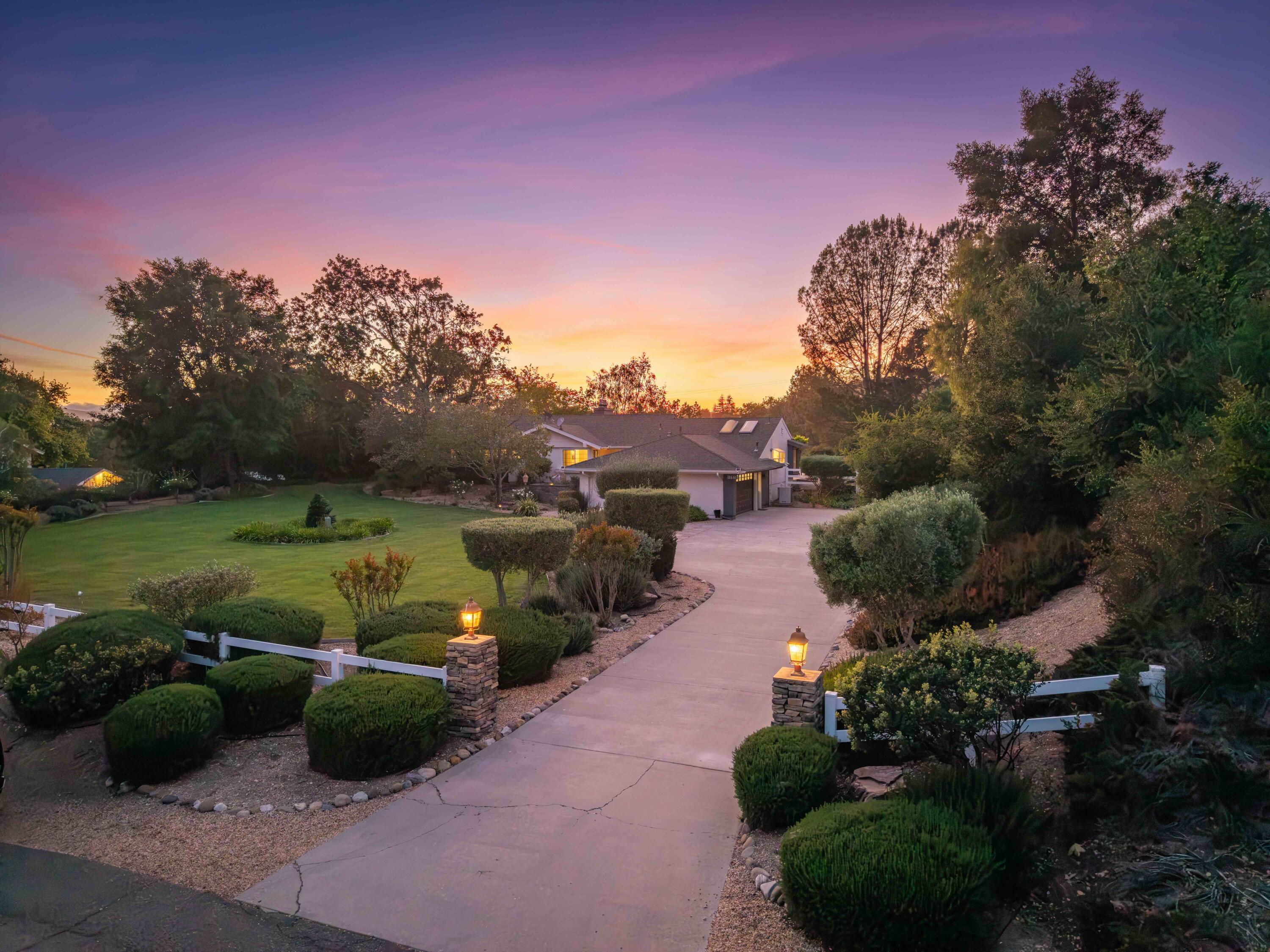 2667 Quail Valley Road Solvang, CA 93463 - Photo 53 of 62 a view of a garden with plants and a bench