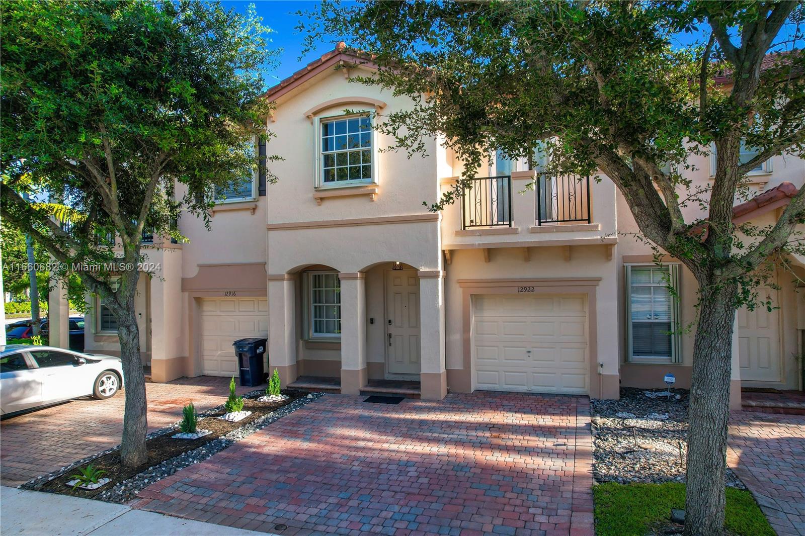 12922 Southwest 135th Street Miami, FL 33186 - Photo 49 of 62 a front view of a house with a tree