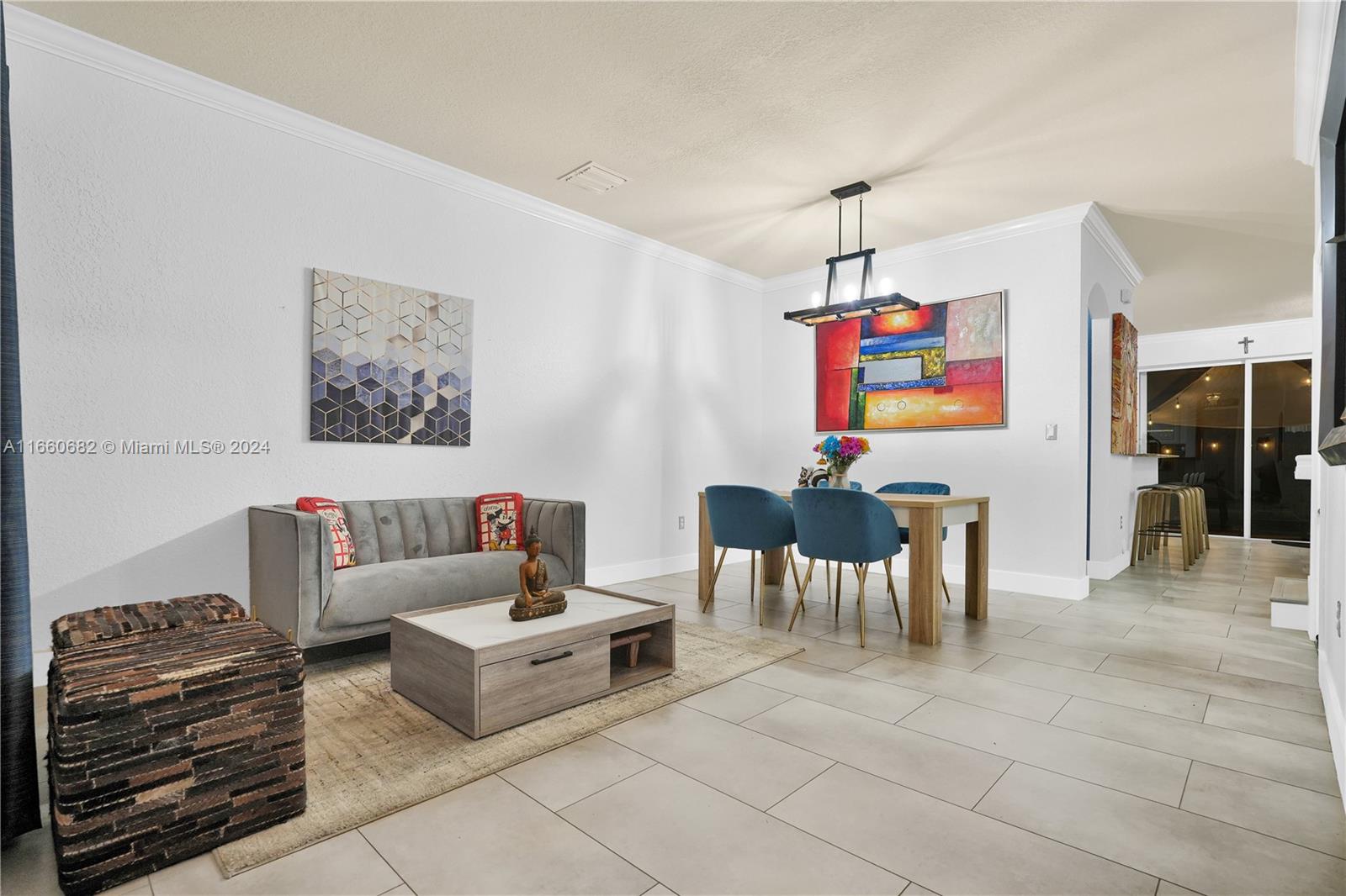 12922 Southwest 135th Street Miami, FL 33186 - Photo 6 of 62 a living room with furniture and a flat screen tv