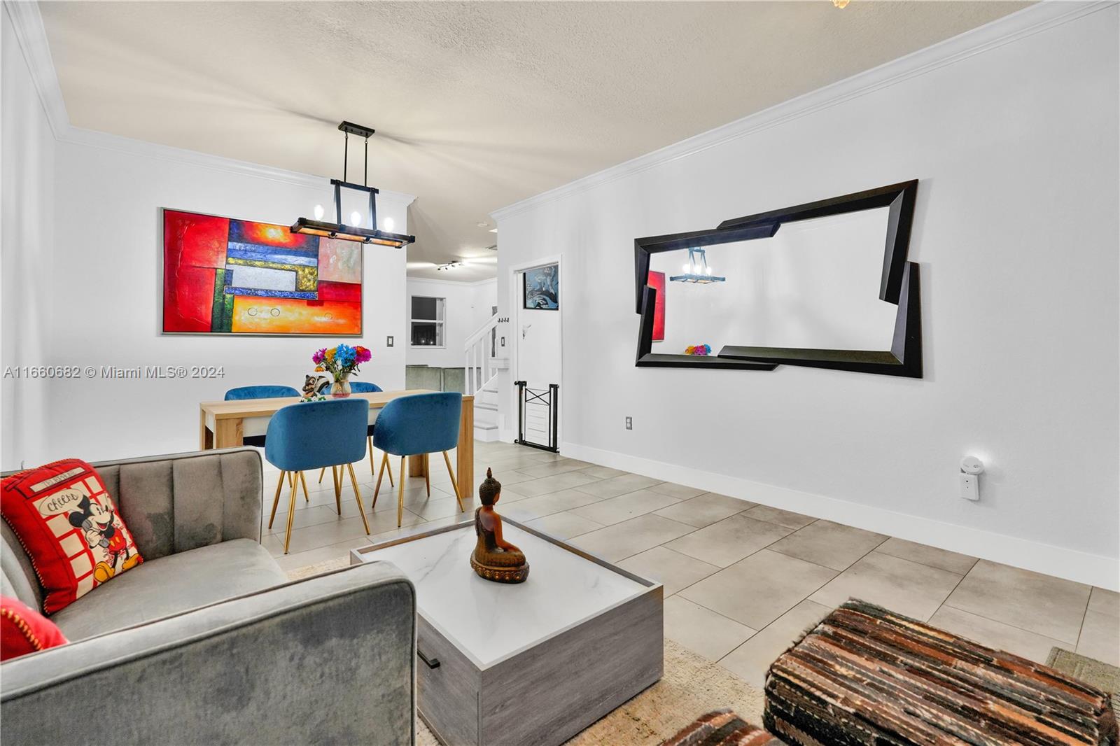 12922 Southwest 135th Street Miami, FL 33186 - Photo 8 of 62 a living room with furniture and a flat screen tv