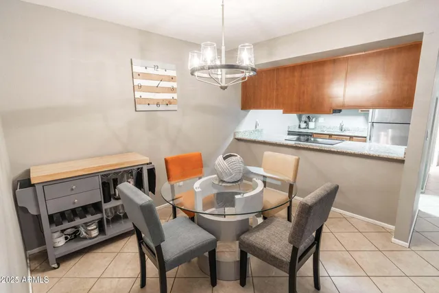a kitchen with granite countertop cabinets stainless steel appliances and a sink