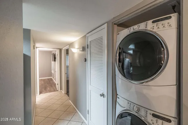 a bathroom with a granite countertop sink toilet a mirror and shower