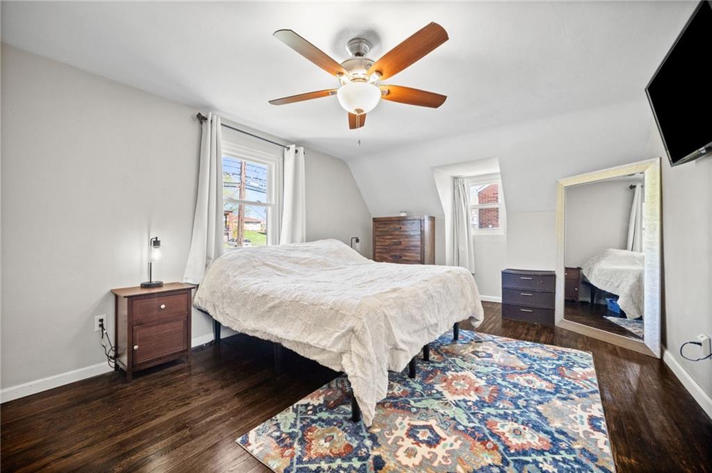 4030 Lebanon Church Road West Mifflin, PA 15122 - Photo 20 of 45 a bedroom with a large bed and a chandelier