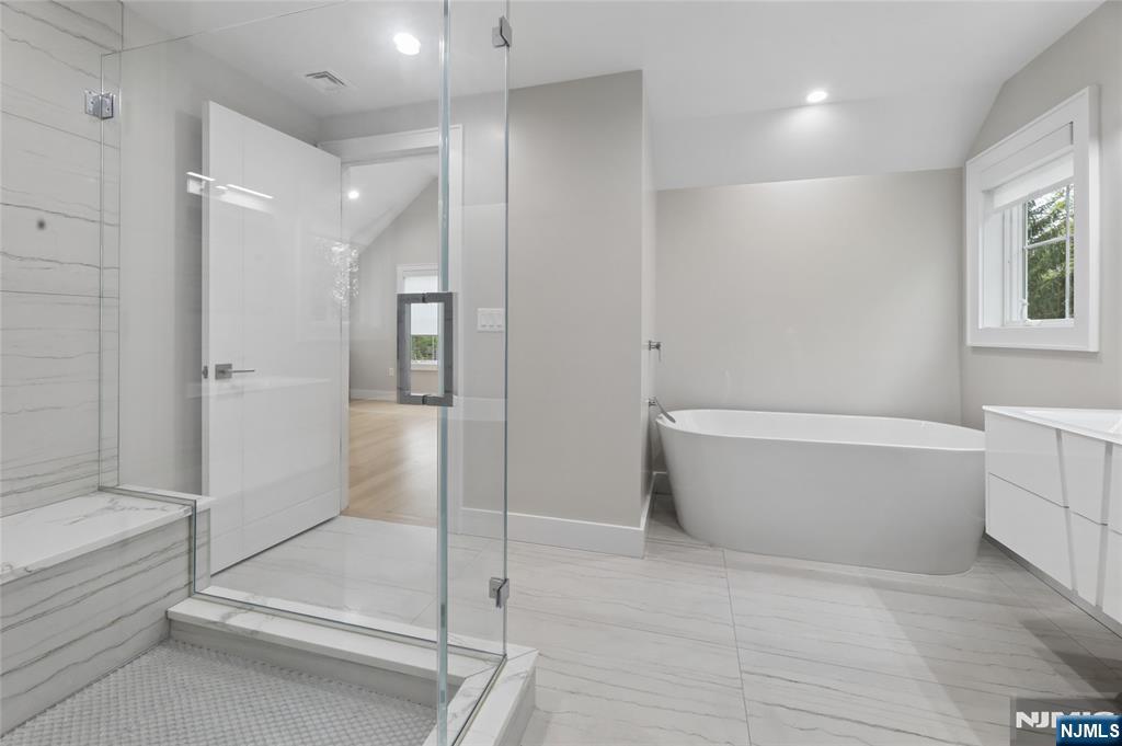 31 Engleside Street Cresskill, NJ 07626 - Photo 30 of 49 a bathroom with a bathtub and shower