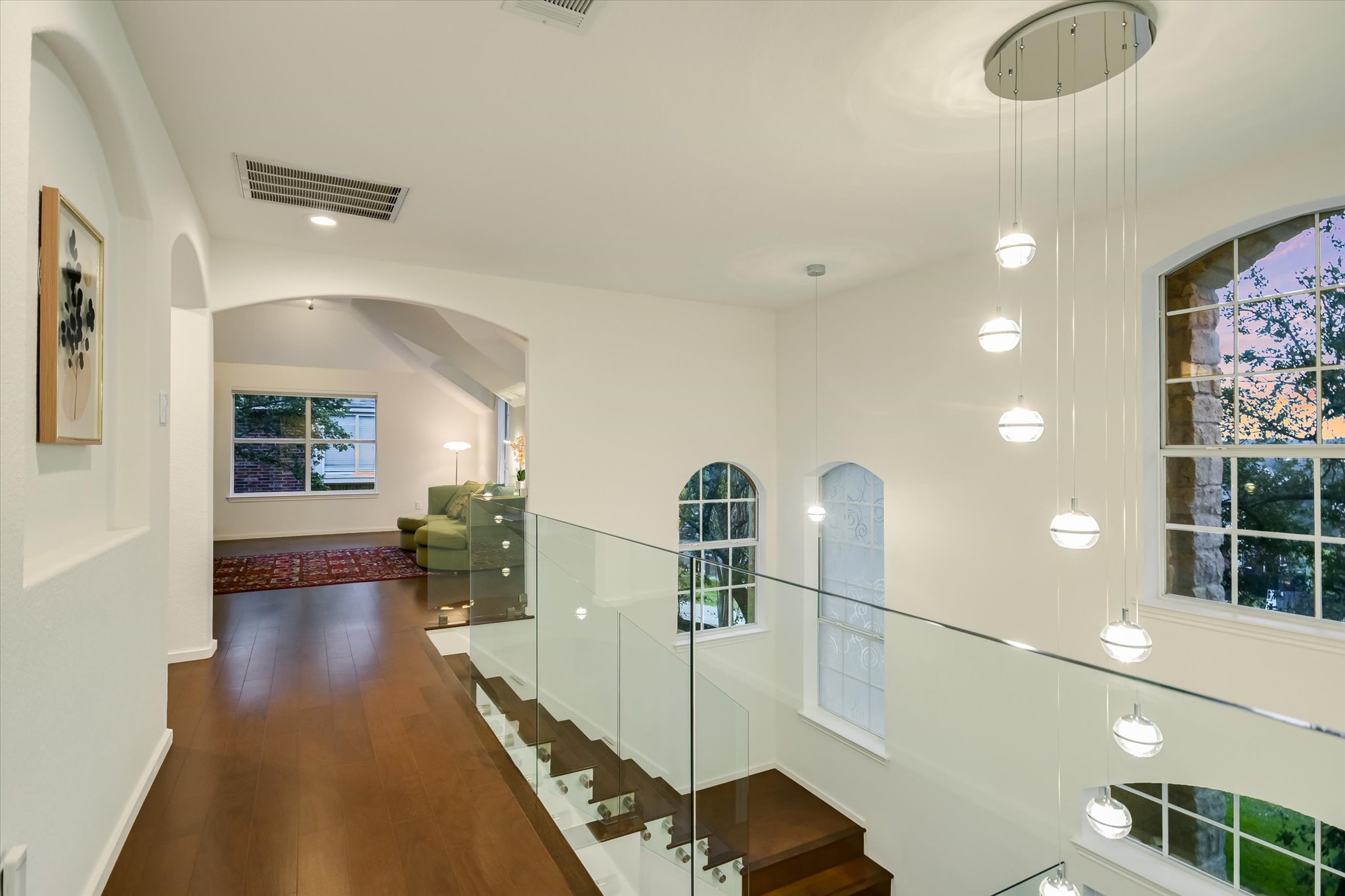 5908 Taylor Draper Cove Austin, TX 78759 - Photo 11 of 40 a view of a hallway with furniture and wooden floor