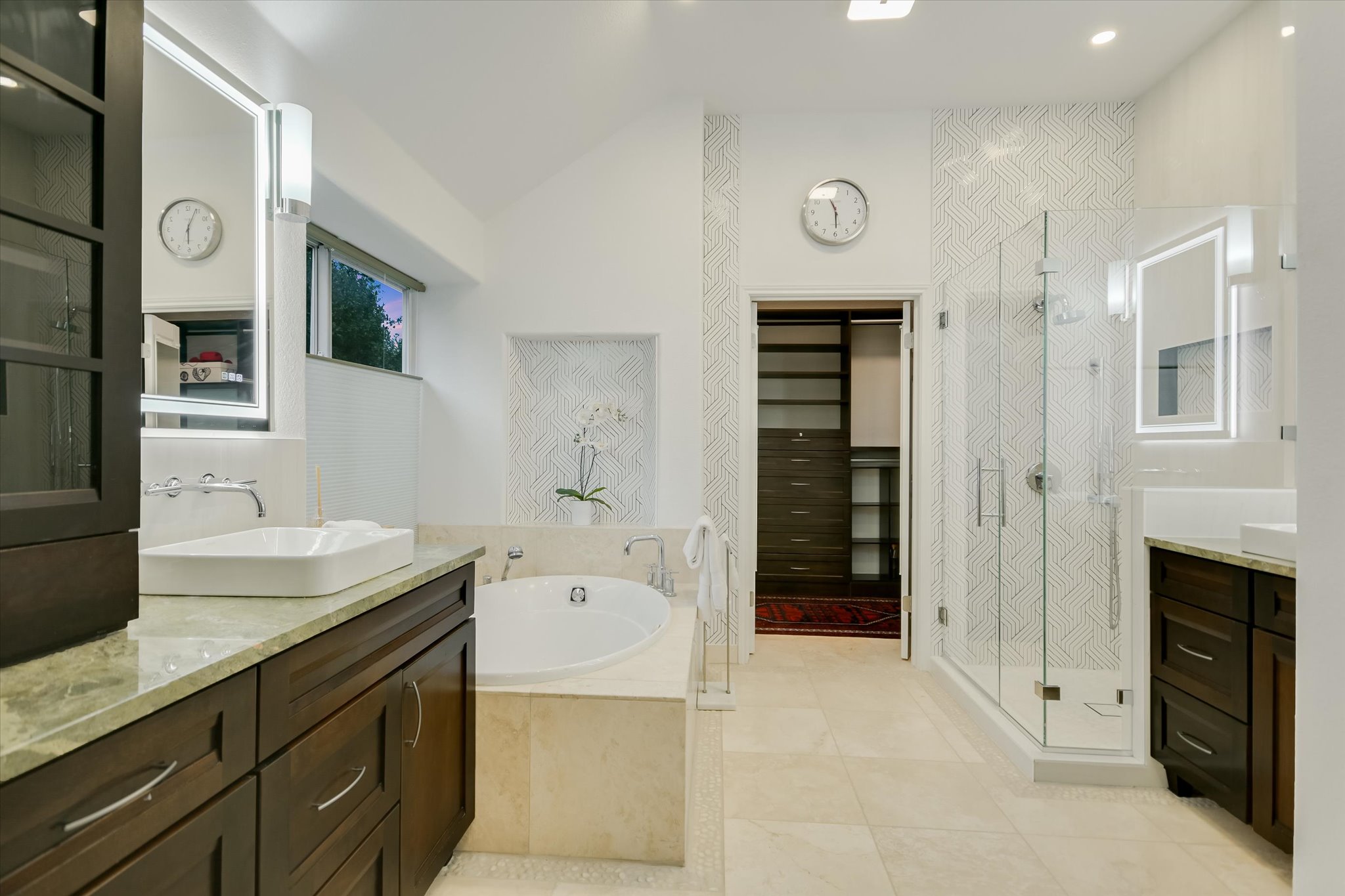 5908 Taylor Draper Cove Austin, TX 78759 - Photo 17 of 40 a spacious bathroom with a granite countertop sink and a mirror