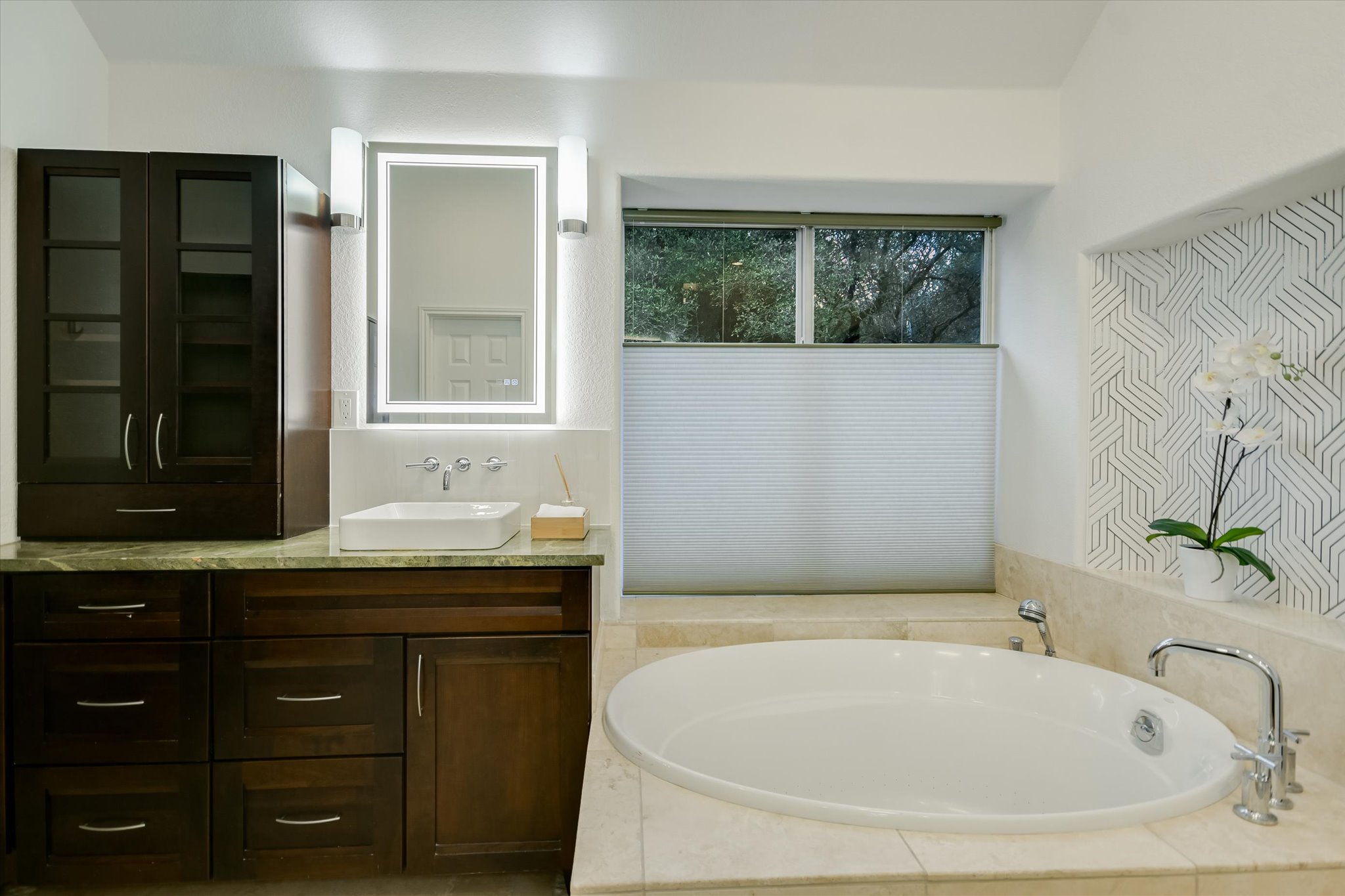 5908 Taylor Draper Cove Austin, TX 78759 - Photo 18 of 40 a bathroom with a tub sink and mirror