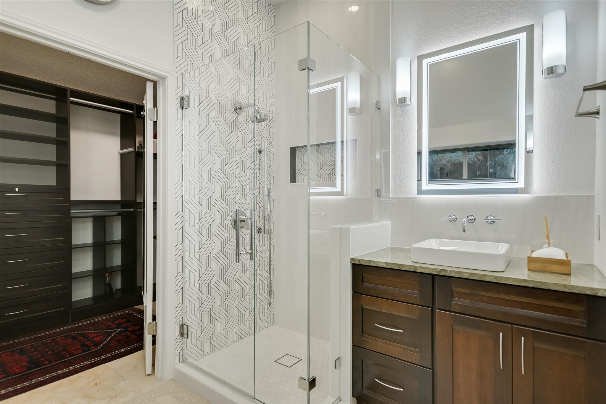 5908 Taylor Draper Cove Austin, TX 78759 - Photo 19 of 40 a bathroom with a shower sink and mirror