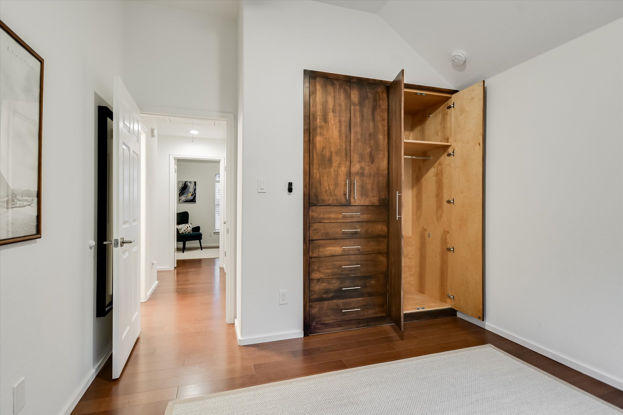 5908 Taylor Draper Cove Austin, TX 78759 - Photo 20 of 40 a view of a hallway with wooden floor and closet area