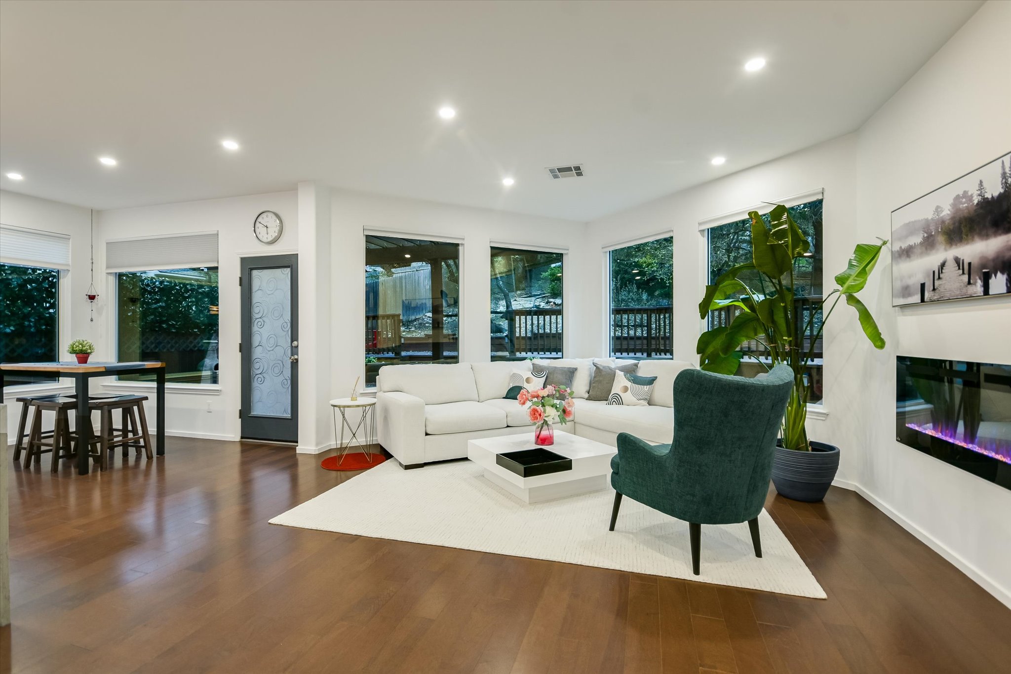 5908 Taylor Draper Cove Austin, TX 78759 - Photo 10 of 40 a living room with furniture a dining table and a potted plant