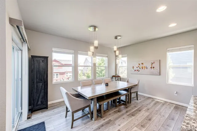 a view of a dining room with furniture window and outside view