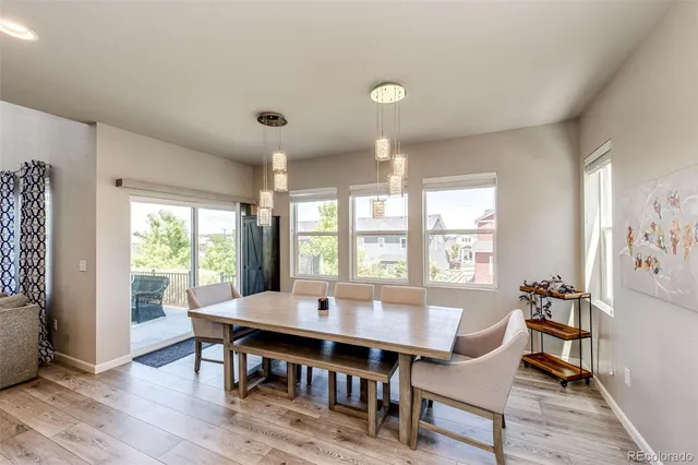 a view of a dining room with furniture window and outside view