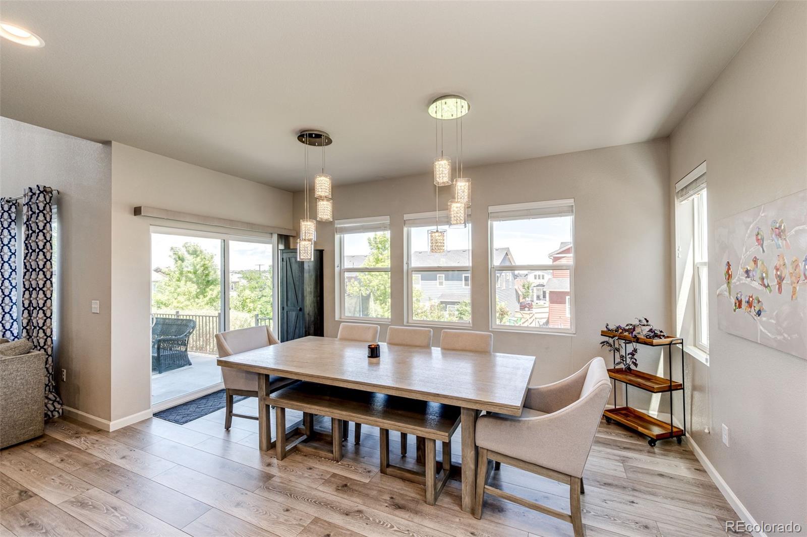 5086 Basalt Ridge Circle Castle Rock, CO 80108 - Photo 16 of 46 a view of a dining room with furniture window and outside view