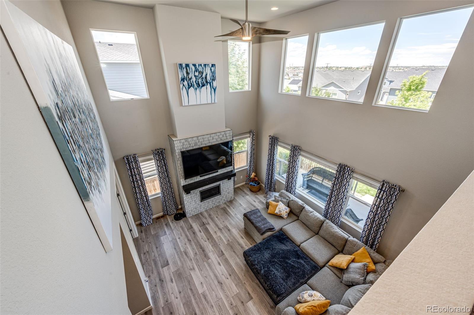 5086 Basalt Ridge Circle Castle Rock, CO 80108 - Photo 20 of 46 a living room with furniture and a fireplace
