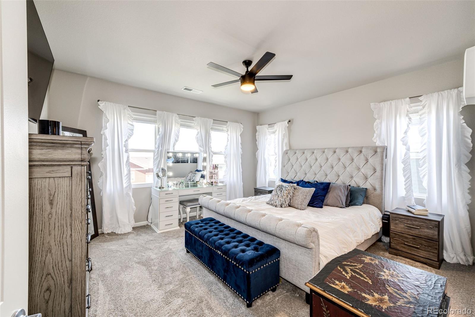 5086 Basalt Ridge Circle Castle Rock, CO 80108 - Photo 22 of 46 a bedroom with a bed and a refrigerator