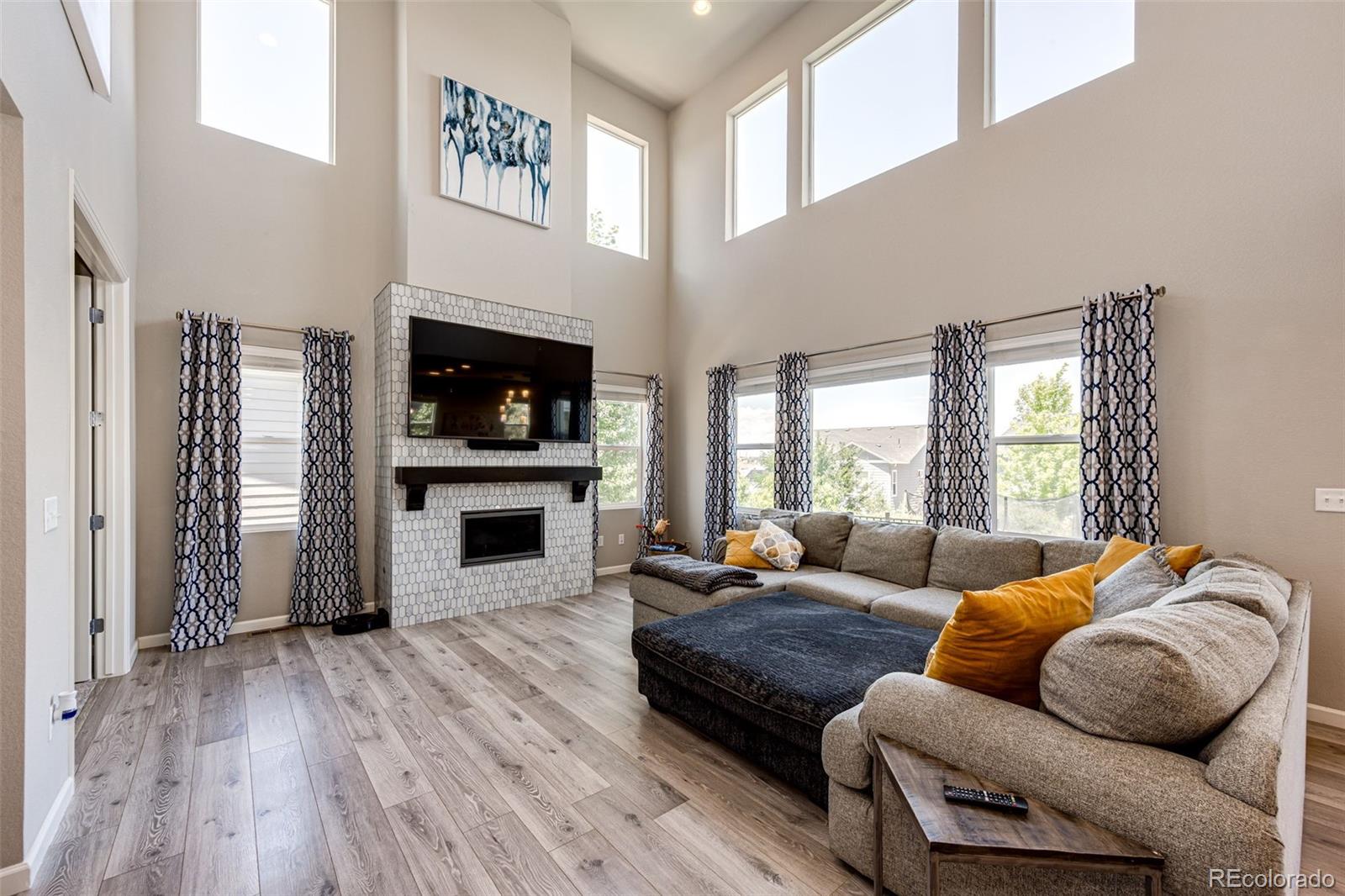 5086 Basalt Ridge Circle Castle Rock, CO 80108 - Photo 7 of 46 a living room with furniture and a fireplace