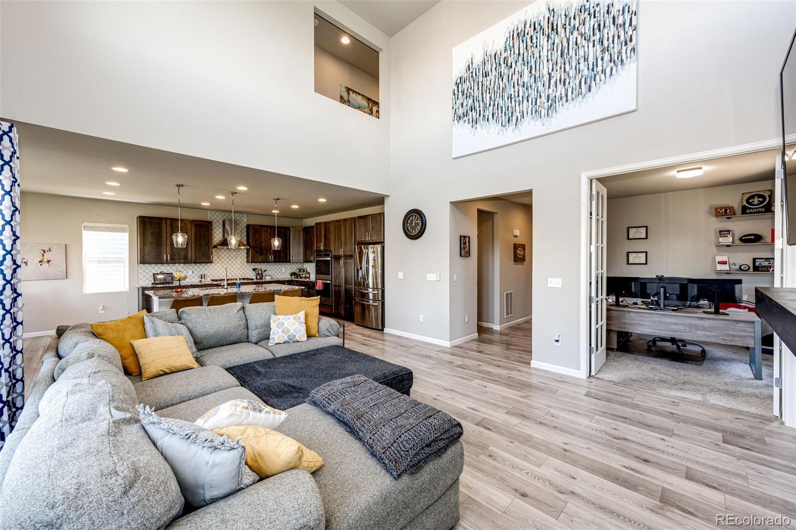5086 Basalt Ridge Circle Castle Rock, CO 80108 - Photo 8 of 46 a living room with furniture and view of kitchen