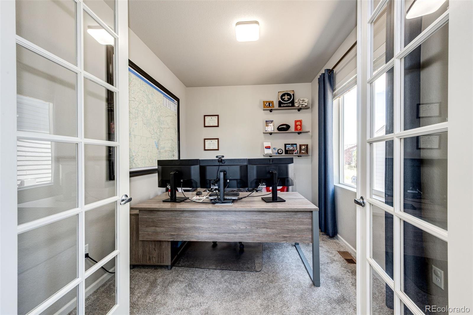 5086 Basalt Ridge Circle Castle Rock, CO 80108 - Photo 9 of 46 a room with furniture a window and a view of kitchen