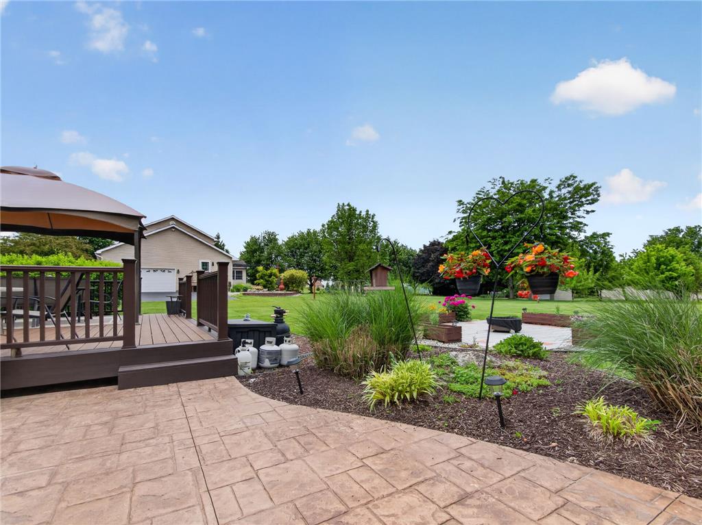 853 Lahr Road Nazareth, PA 18064 - Photo 24 of 29 A spacious backyard patio and wooden deck offer ample room for outdoor leisure and entertaining.
