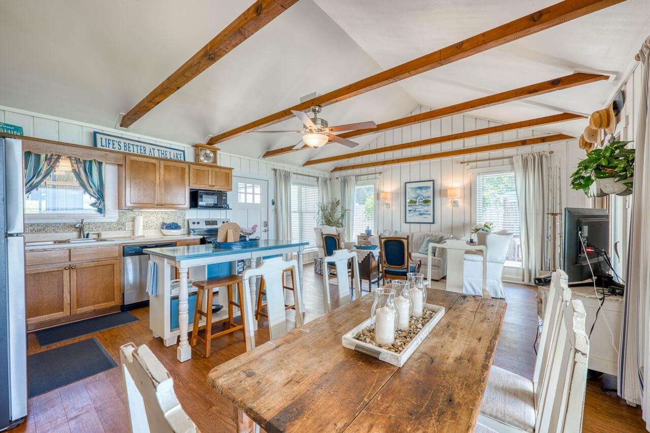 809 Lakeshore Loop Tow, TX 78672 - Photo 8 of 33 a view of a dining room with furniture a chandelier and wooden floor