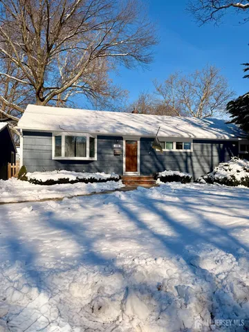 a view of a building with cars parked