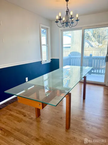 a room with pool table and windows