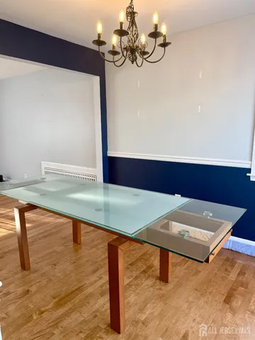 a view of a room with a hanging light