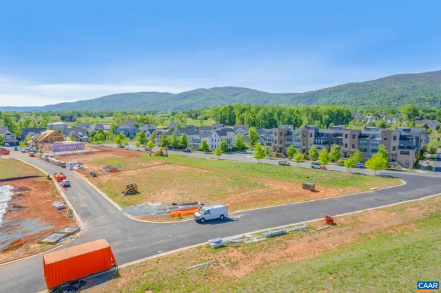an aerial view of a city with lawn chairs