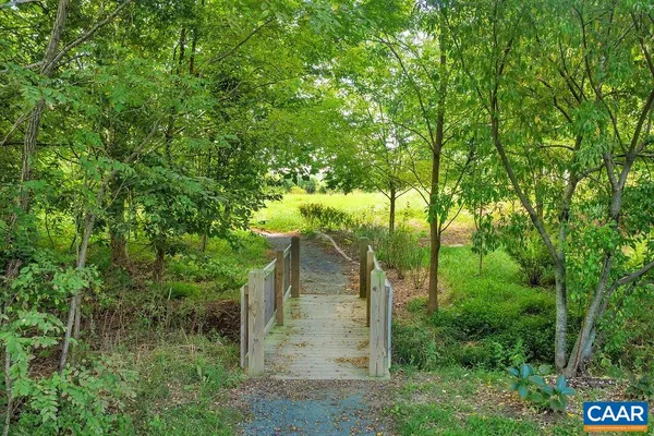 front view of a house with a tree