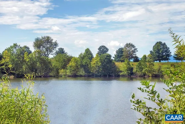 a view of a lake with a big yard