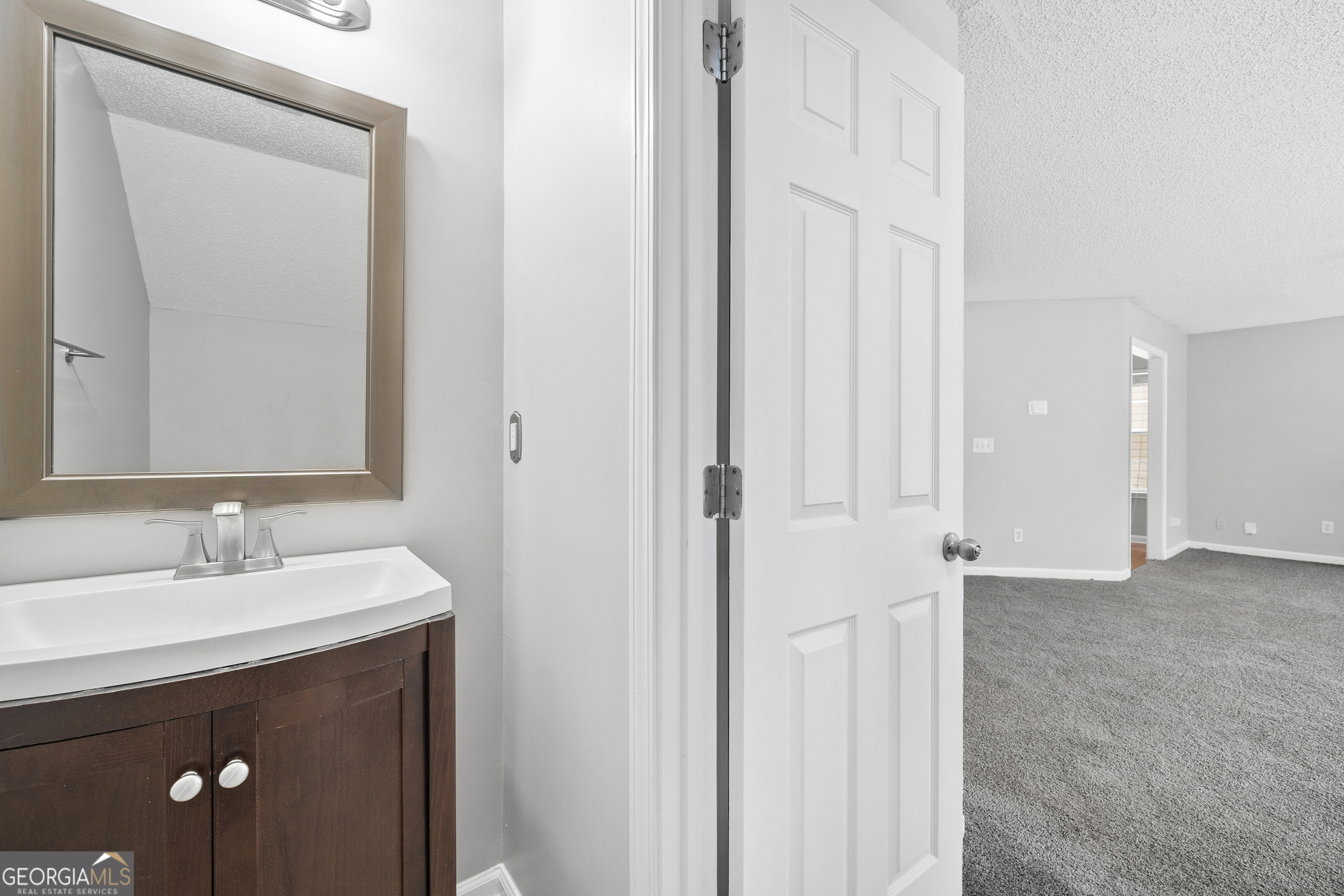 1883 Simmons Lane Hampton, GA 30228 - Photo 11 of 28 a bathroom with a sink and a mirror