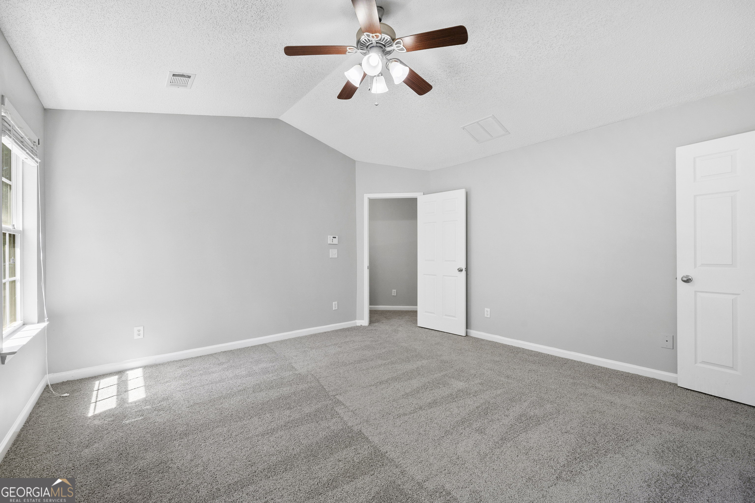 1883 Simmons Lane Hampton, GA 30228 - Photo 15 of 28 a view of an empty room with a window