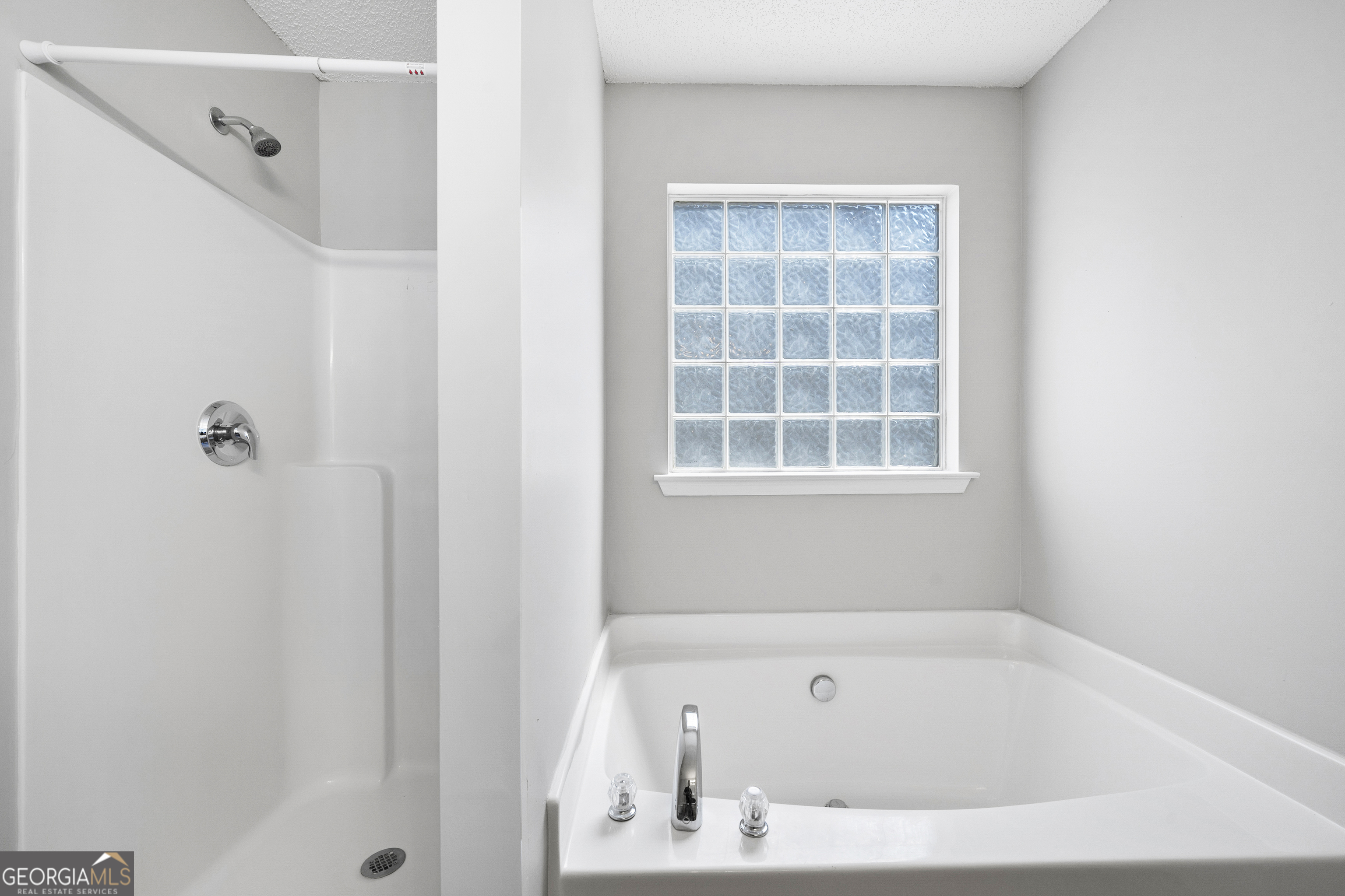 1883 Simmons Lane Hampton, GA 30228 - Photo 18 of 28 a white bath tub sitting next to a window