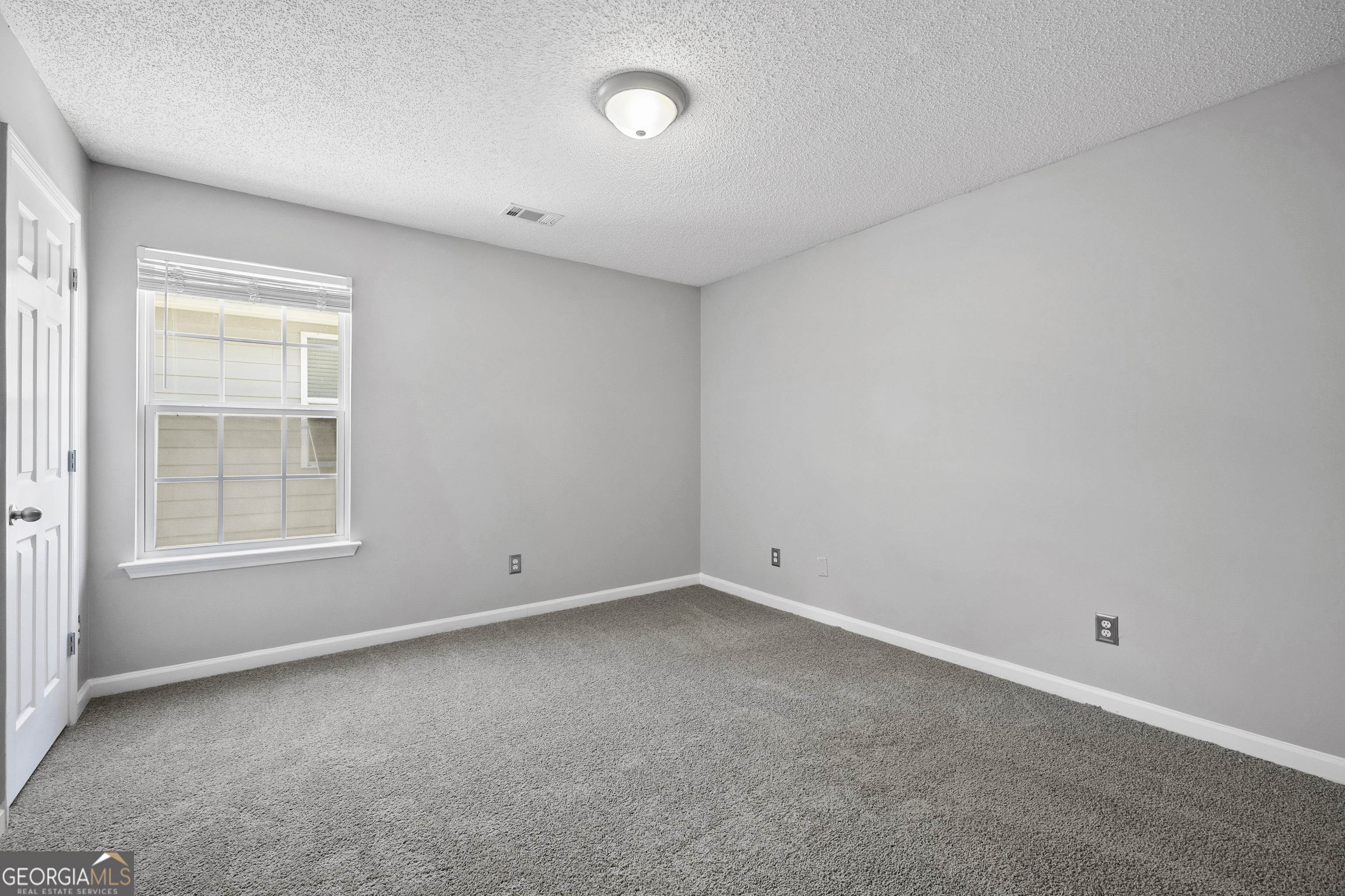 1883 Simmons Lane Hampton, GA 30228 - Photo 20 of 28 an empty room with a window