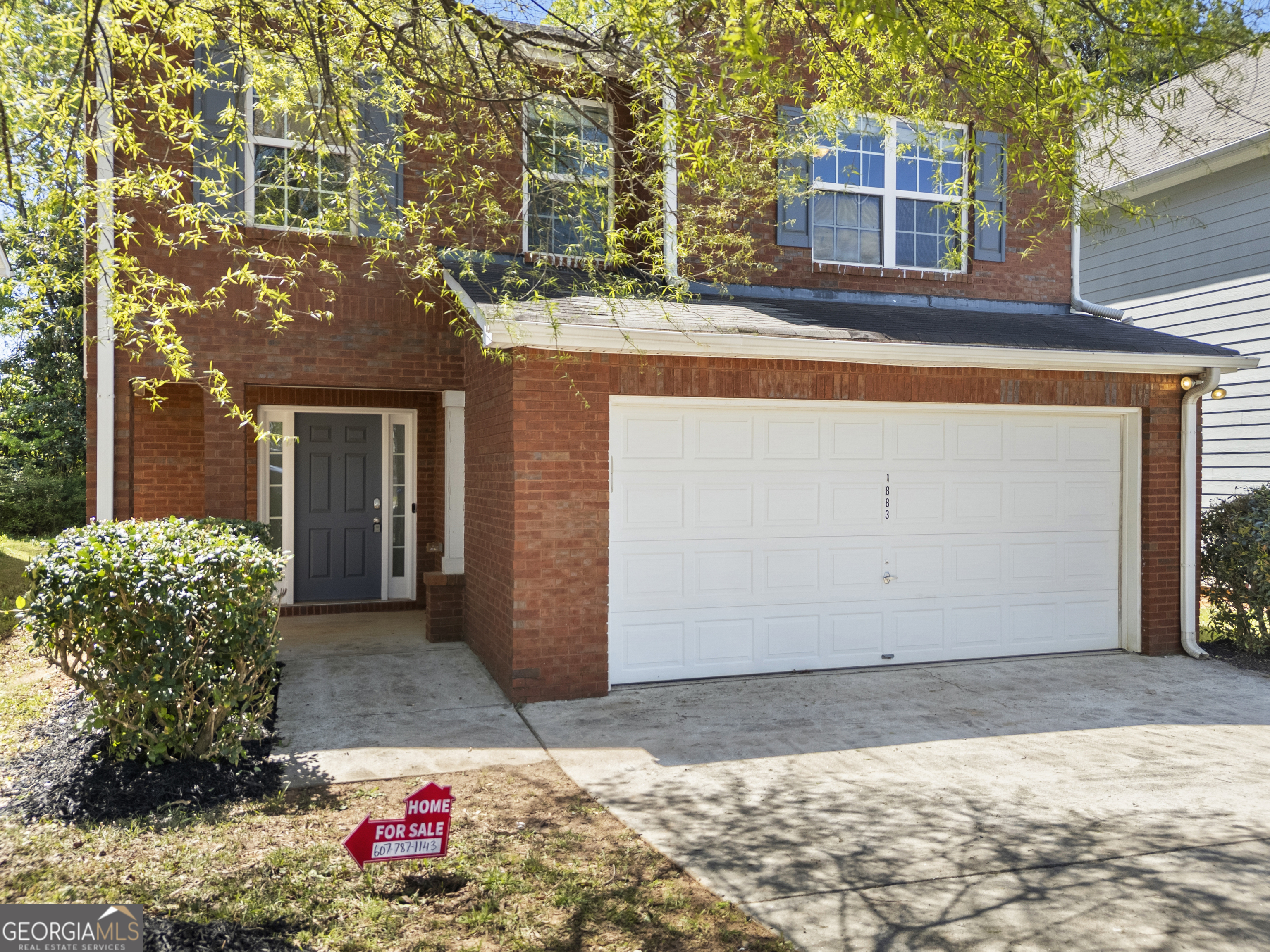 1883 Simmons Lane Hampton, GA 30228 - Photo 2 of 28 a front view of a house with a yard