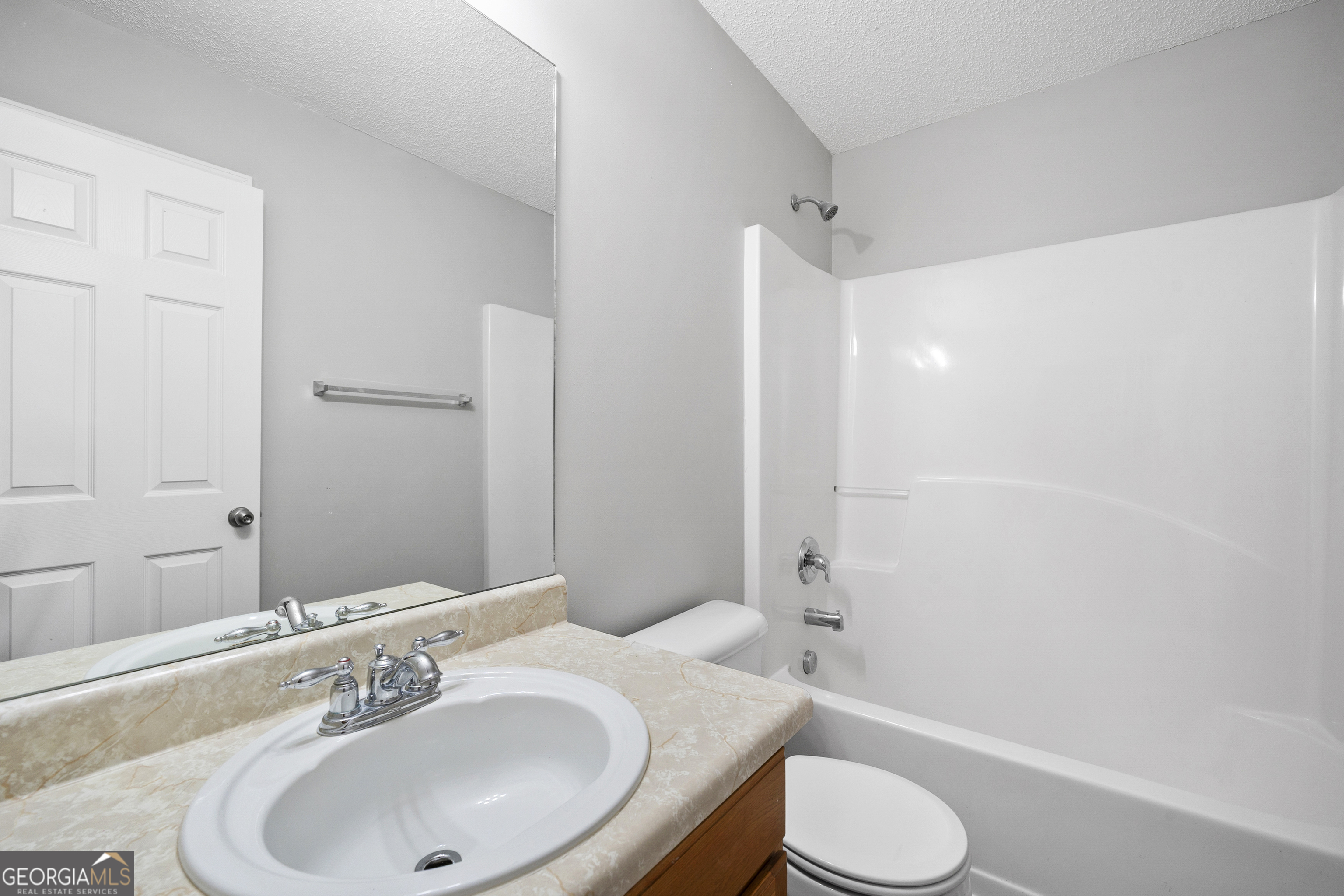 1883 Simmons Lane Hampton, GA 30228 - Photo 22 of 28 a bathroom with a sink toilet and shower