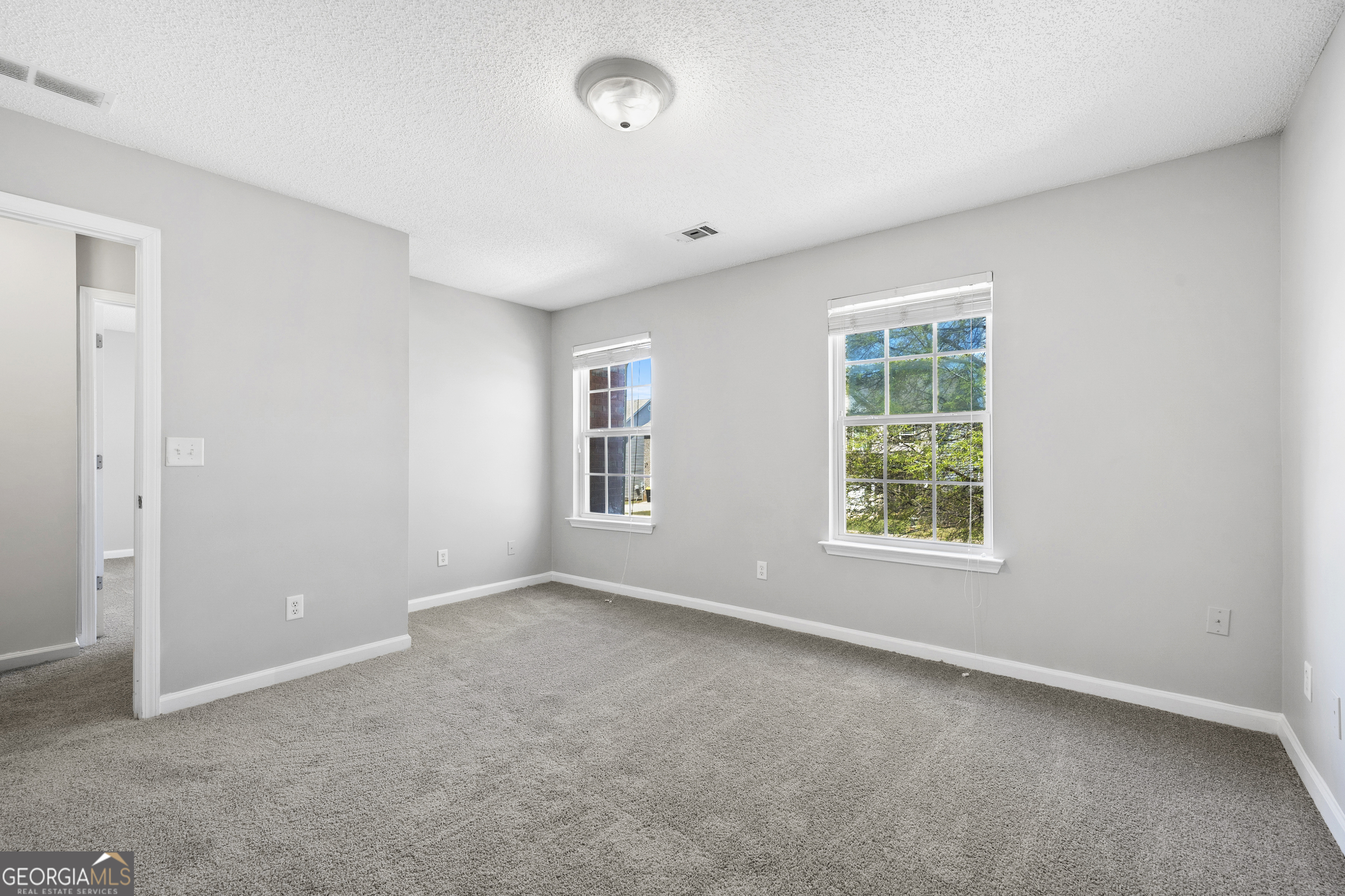 1883 Simmons Lane Hampton, GA 30228 - Photo 23 of 28 an empty room with a window