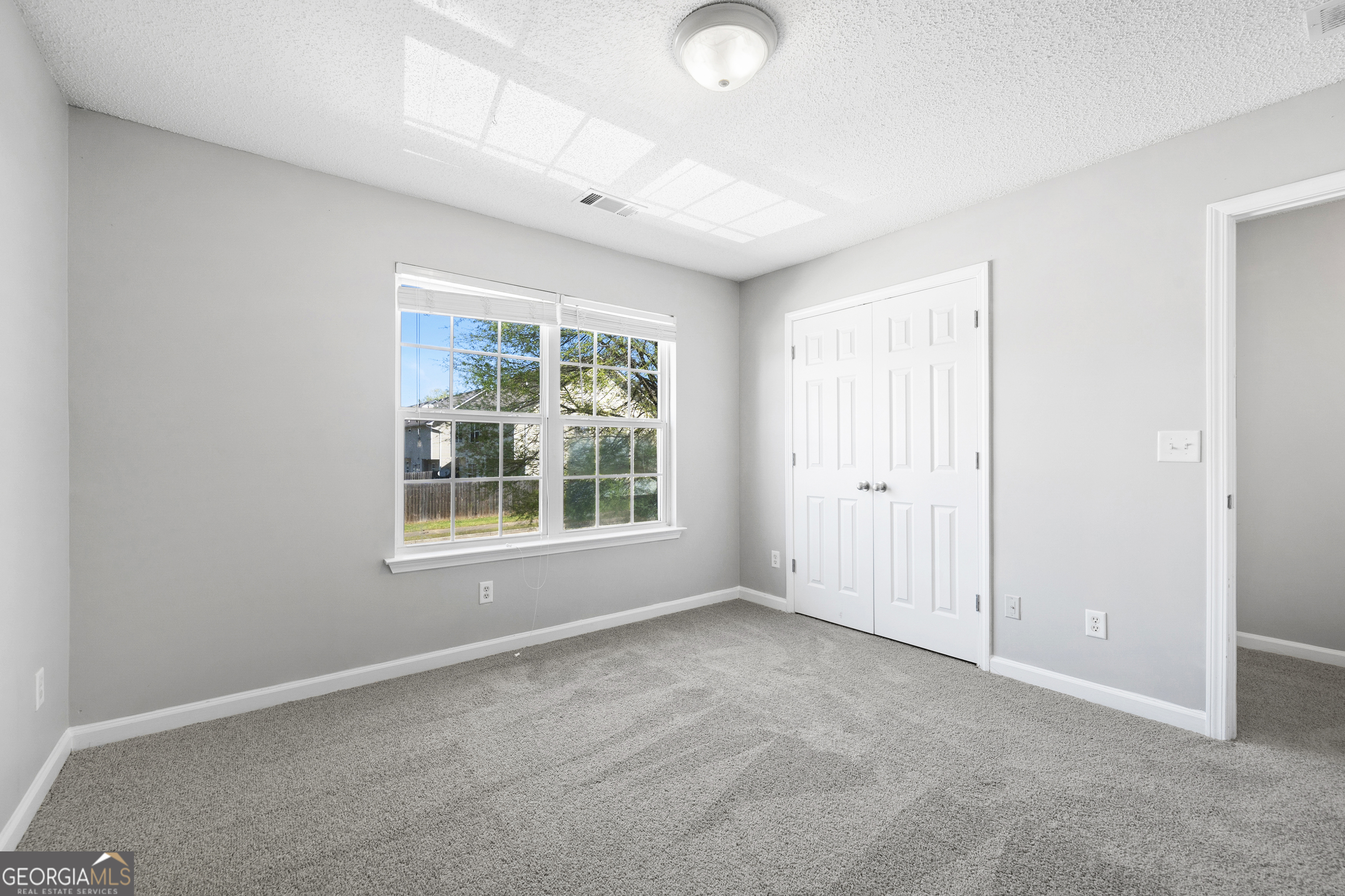 1883 Simmons Lane Hampton, GA 30228 - Photo 25 of 28 an empty room with a window