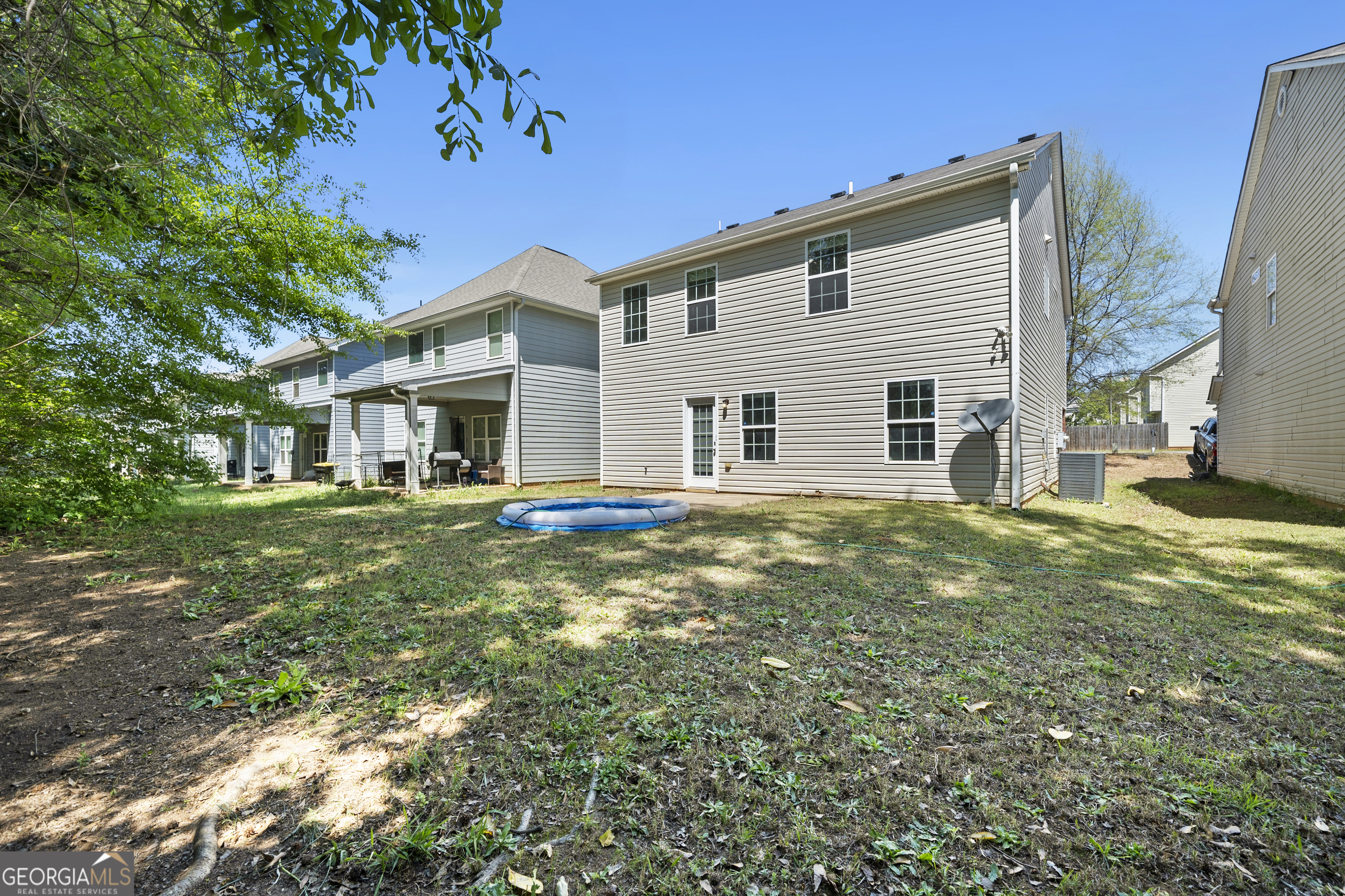 1883 Simmons Lane Hampton, GA 30228 - Photo 28 of 28 a view of a house with a backyard