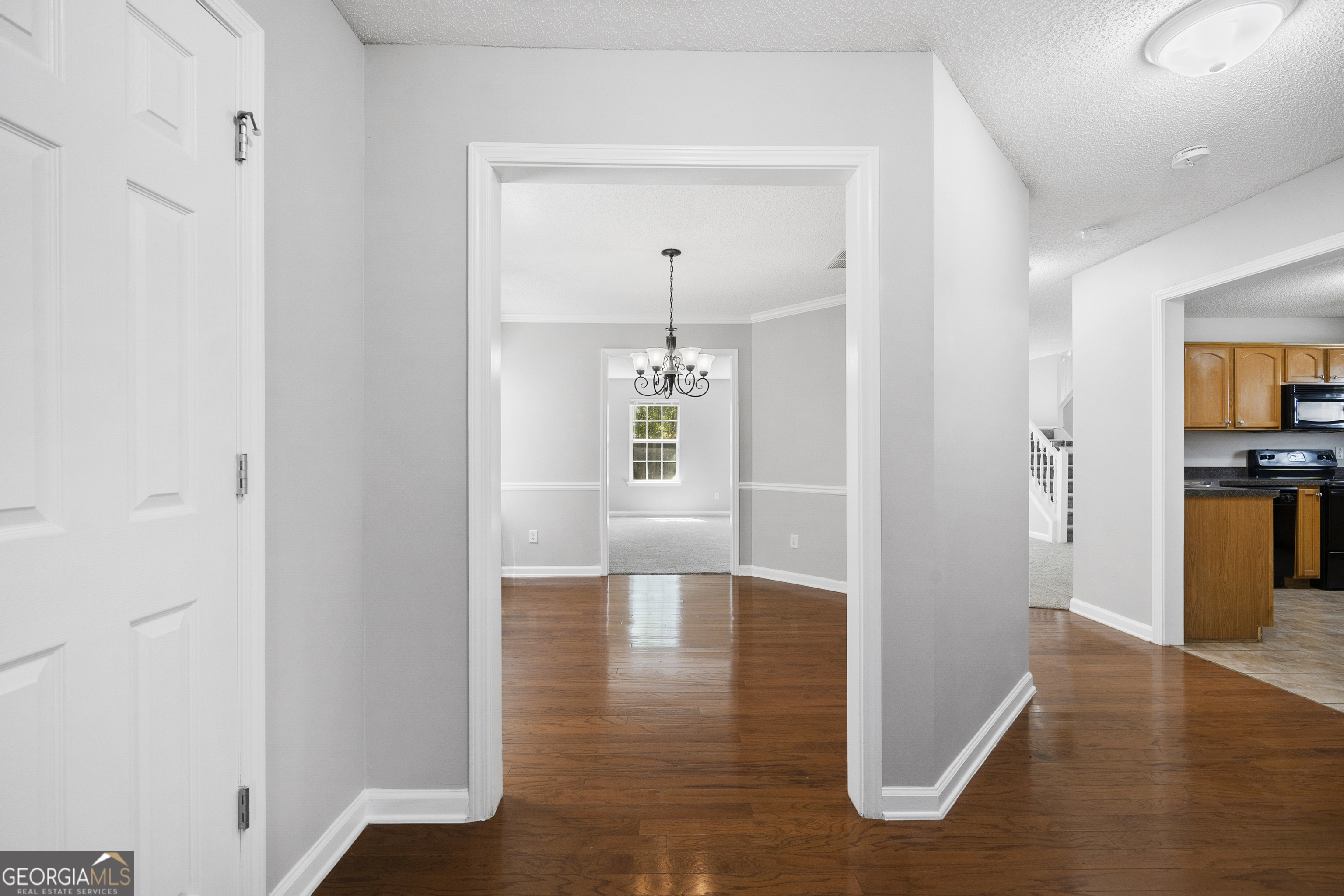1883 Simmons Lane Hampton, GA 30228 - Photo 5 of 28 a view of livingroom with hardwood floor and a ceiling fan