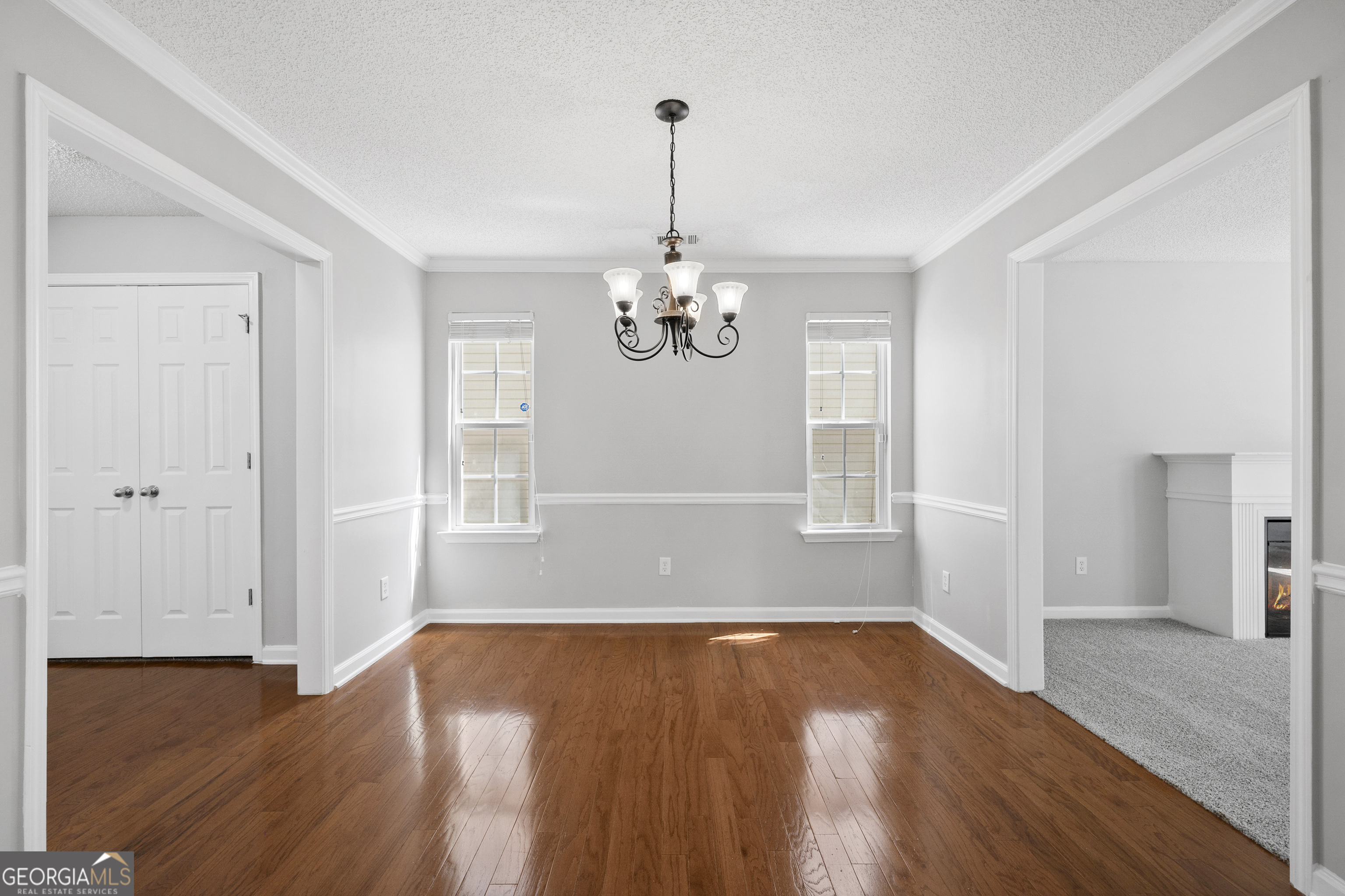 1883 Simmons Lane Hampton, GA 30228 - Photo 6 of 28 a view of empty room with wooden floor and window