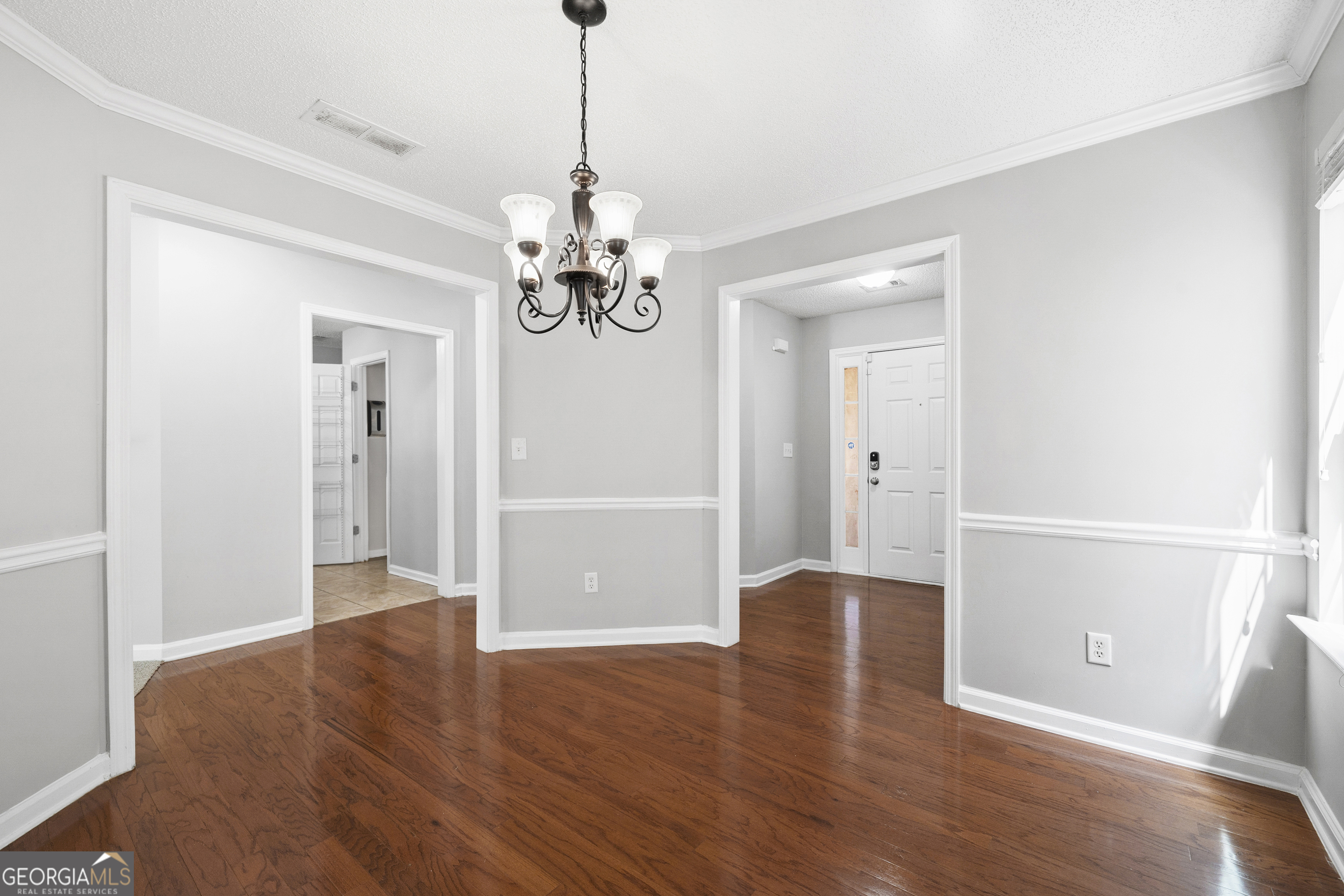 1883 Simmons Lane Hampton, GA 30228 - Photo 7 of 28 a view of empty room with wooden floor