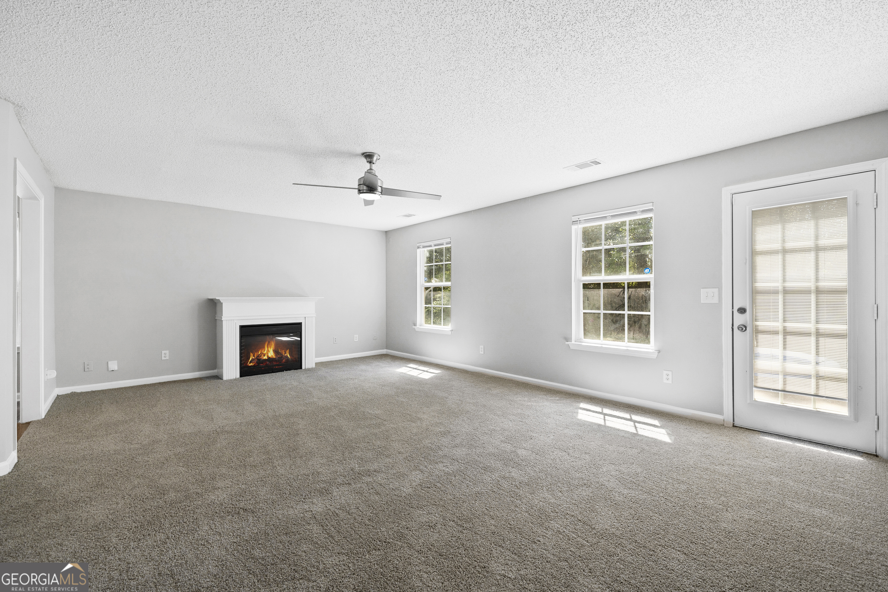 1883 Simmons Lane Hampton, GA 30228 - Photo 10 of 28 an empty room with windows