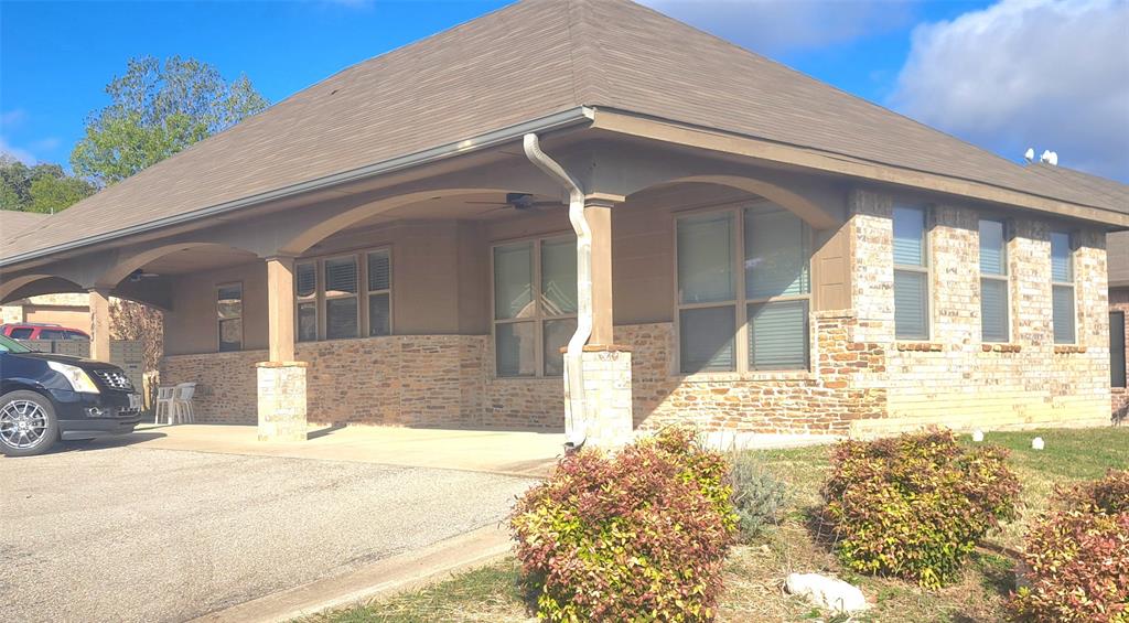 1301 Old Dicey Road, Unit 443 Weatherford, TX 76085 - Photo 2 of 11 a view of a house with a yard