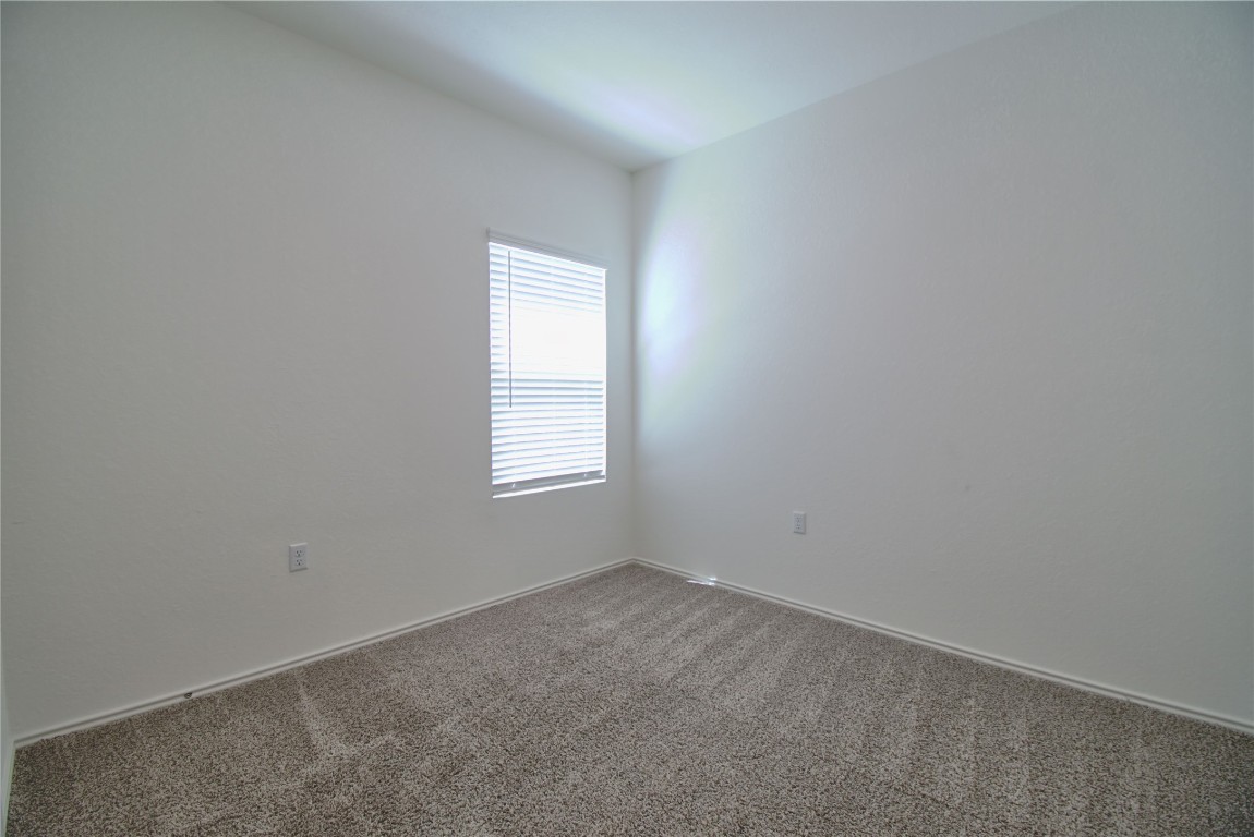 2233 Forgetmenot Lane Pflugerville, TX 78660 - Photo 12 of 28 an empty room with a window