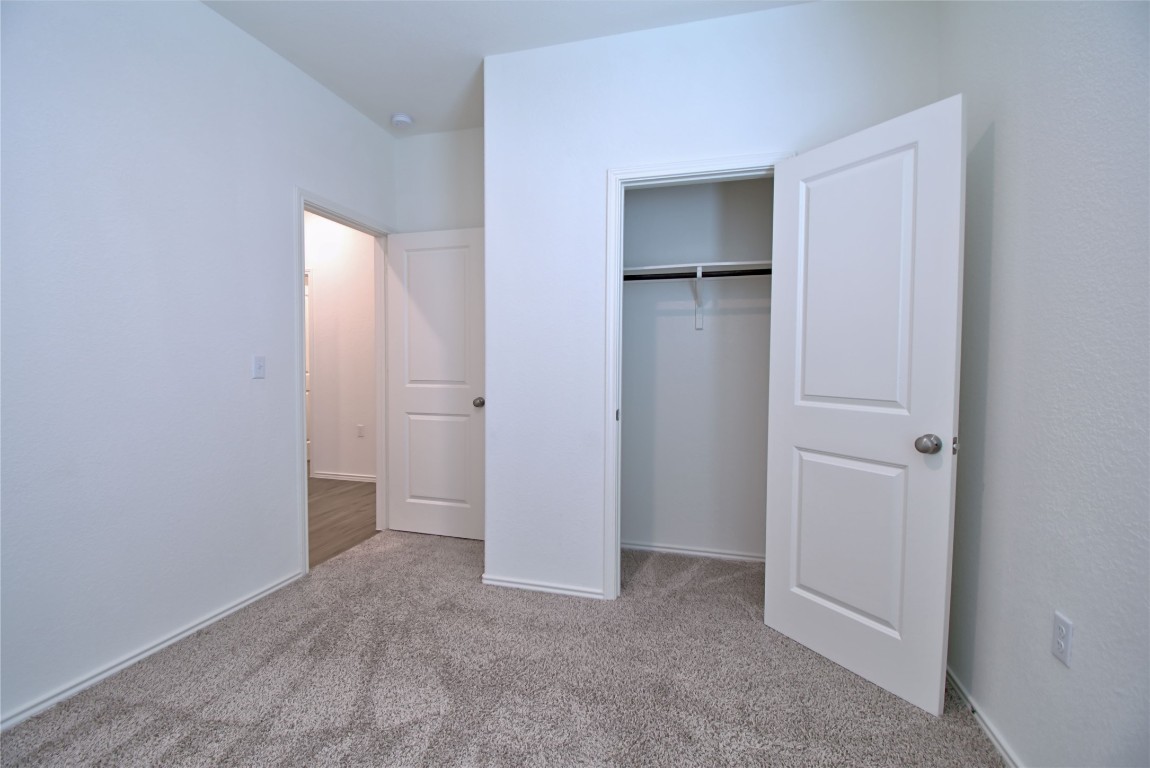 2233 Forgetmenot Lane Pflugerville, TX 78660 - Photo 13 of 28 a view of an empty room with closet area