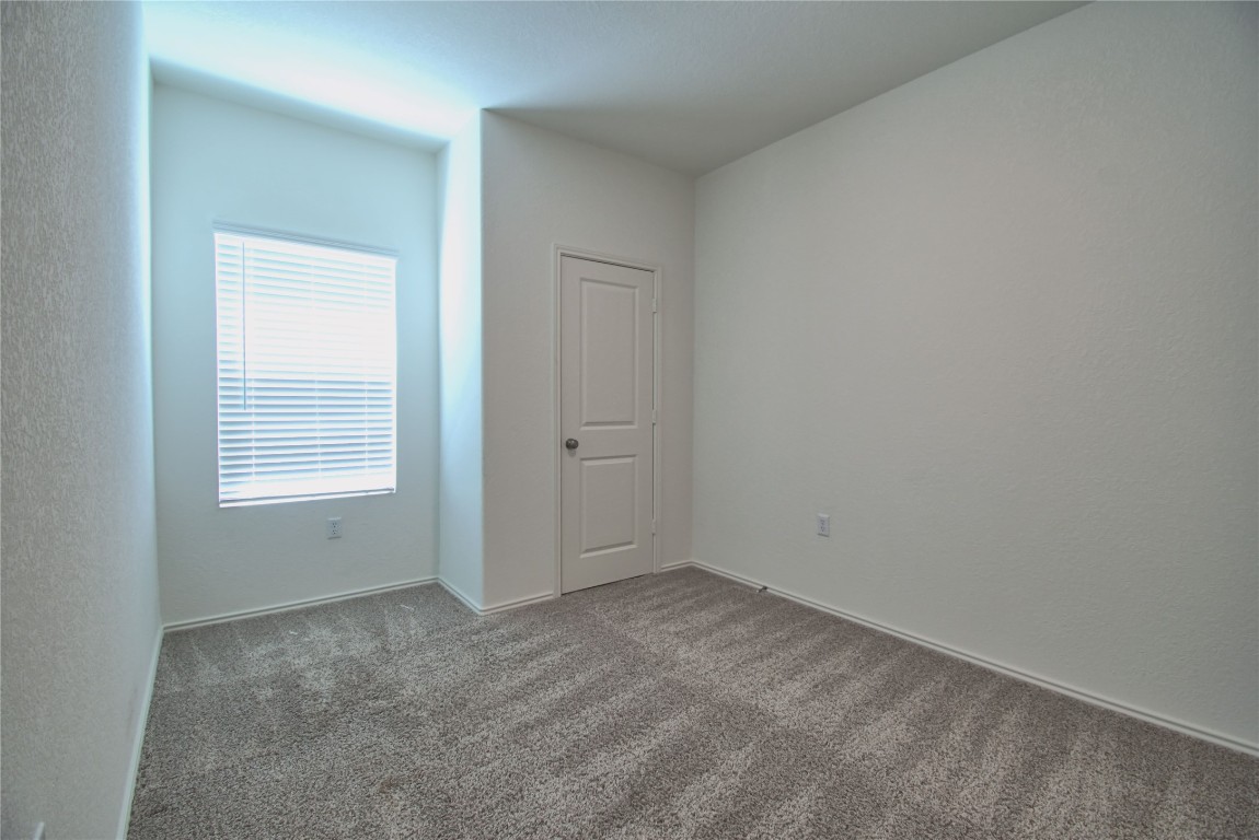 2233 Forgetmenot Lane Pflugerville, TX 78660 - Photo 16 of 28 an empty room with a window
