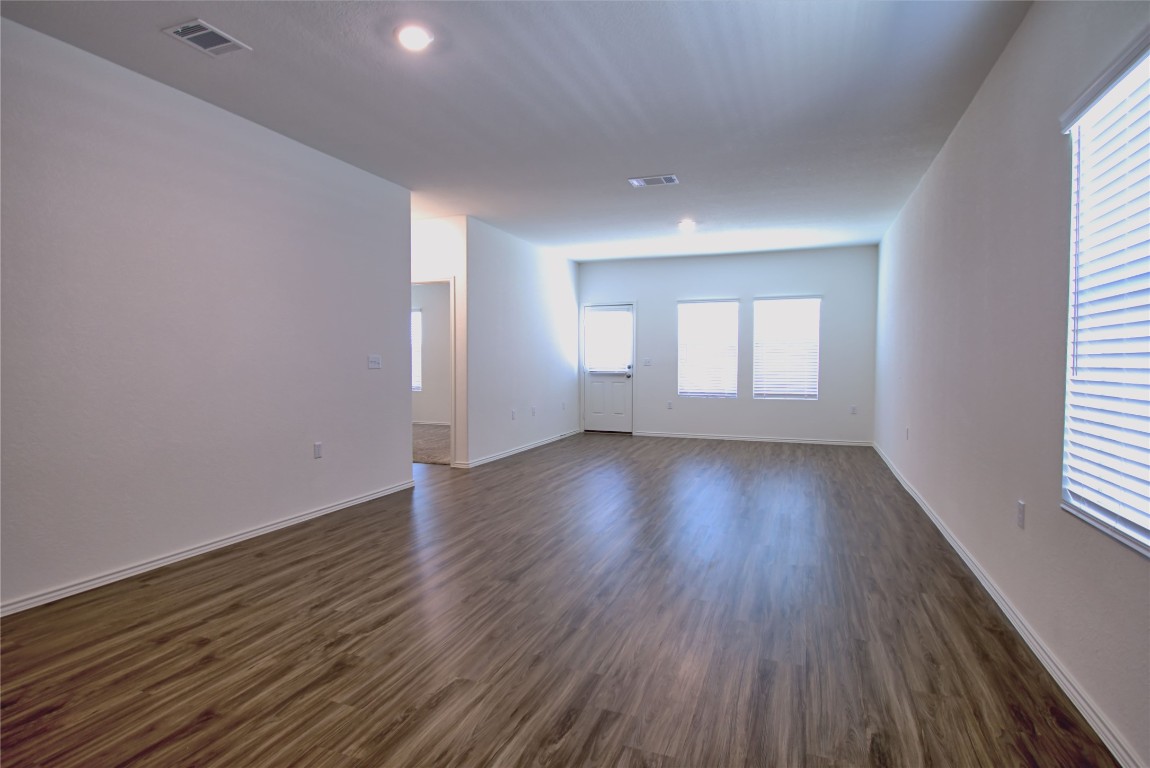 2233 Forgetmenot Lane Pflugerville, TX 78660 - Photo 19 of 28 an empty room with wooden floor and window