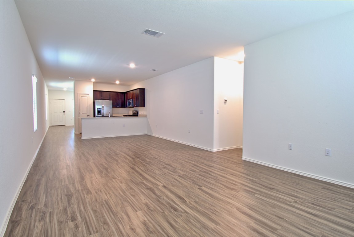 2233 Forgetmenot Lane Pflugerville, TX 78660 - Photo 20 of 28 a view of empty room with wooden floor