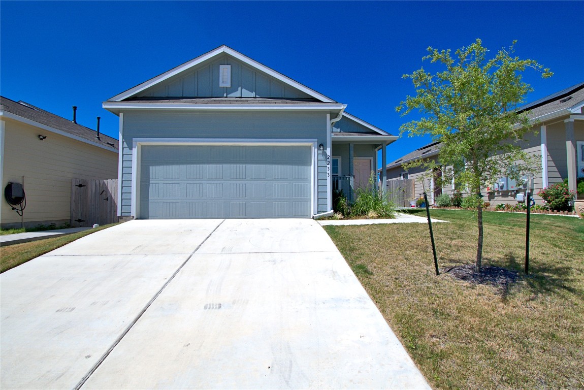2233 Forgetmenot Lane Pflugerville, TX 78660 - Photo 2 of 28 a front view of a house with a yard